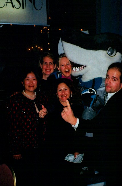 People posing with San Jose Sharks mascot